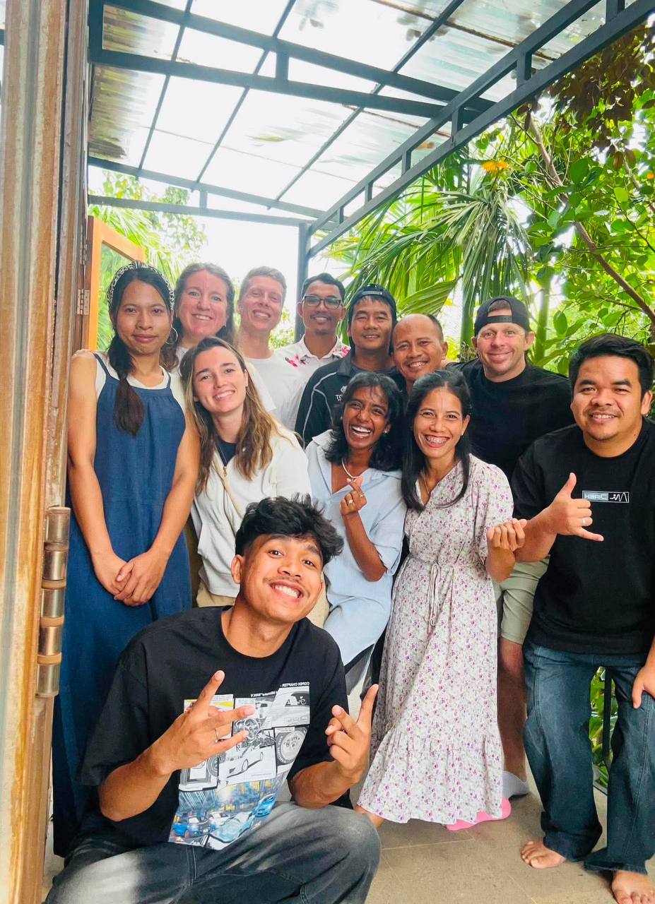 Brieya with a group of ministry staff and friends gathered on a porch in Cambodia.